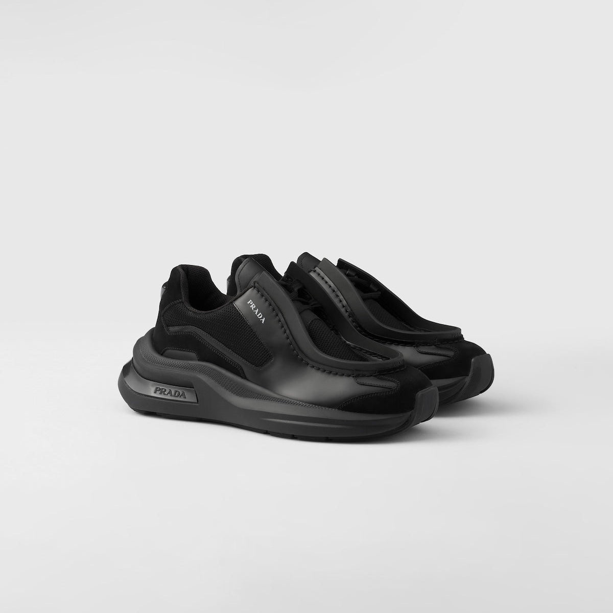 PRADA
Systeme brushed leather sneakers with bike fabric and suede elements